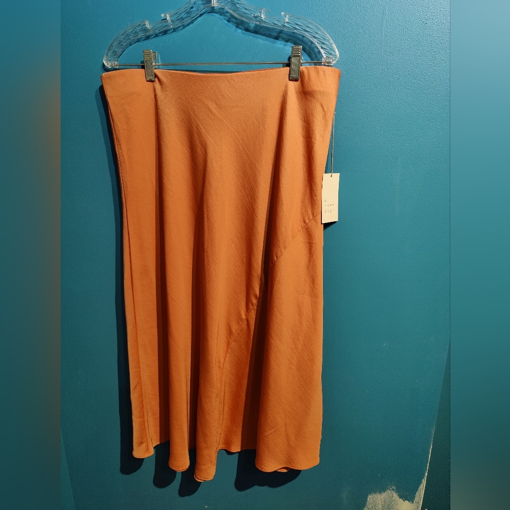 A new day XL orange long skirt with elastic waist band.  100% polyester.